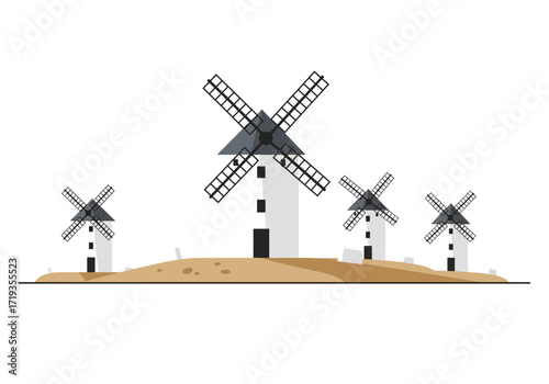 Four windmills with white towers and dark gray sails stand on a sandy hill