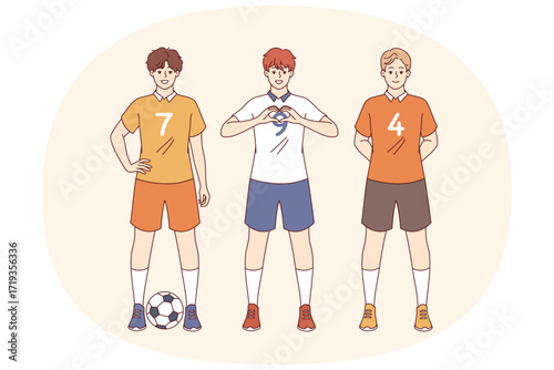 Team of soccer players plays in professional league, and poses in sports uniforms with numbers. Football players from school team smile, preparing for game and dream of competing in competitions