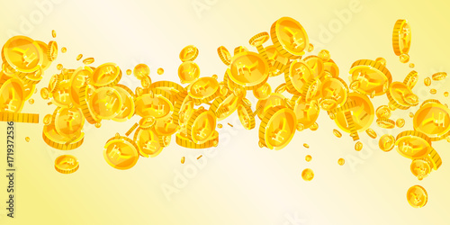 Indian rupee coins falling. Scattered gold INR
