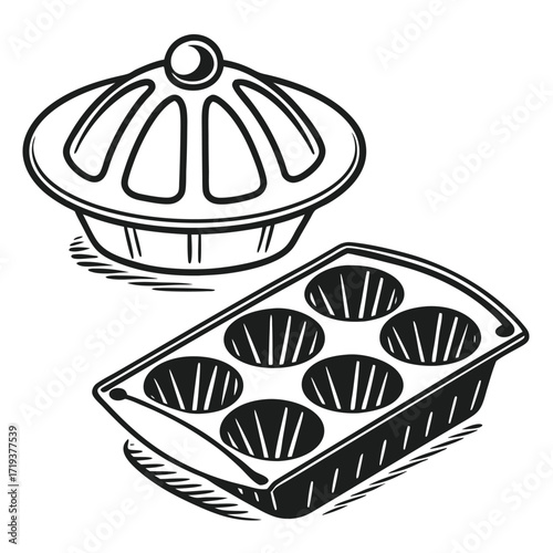 Black and white muffin tin with cake mold depicts baking equipment details