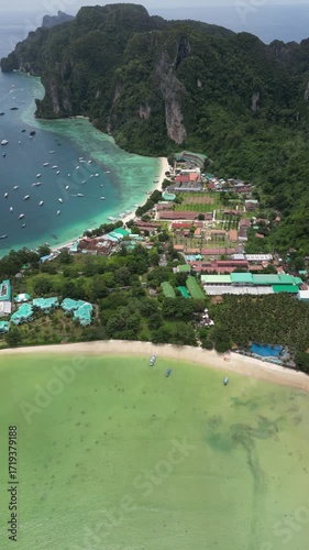 Drone video in portrait of Koh Phi Phi Don with Longtail Boats