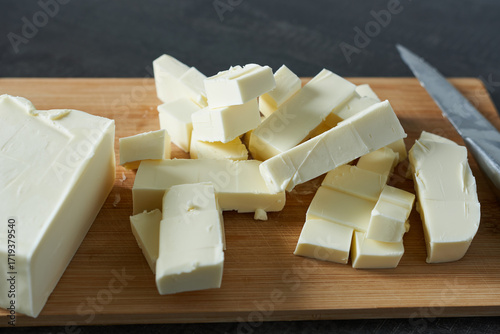 Slices of butter on a cutting board, close-up