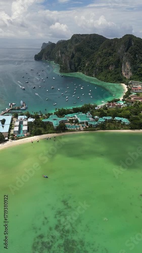 Drone video in portrait of Koh Phi Phi Don with Longtail Boats