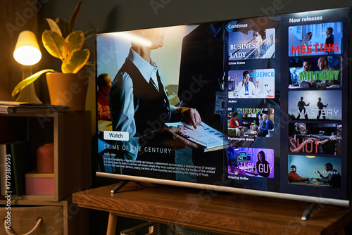 Foto Modern flat screen television displaying streaming service interface with variou