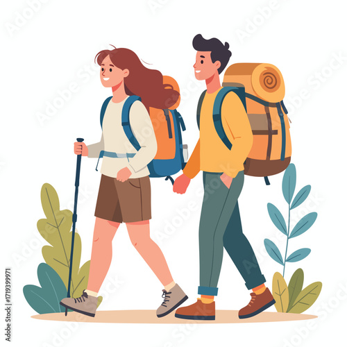 A couple hiking together, holding hands, with backpacks and walking stick, surrounded by foliage.