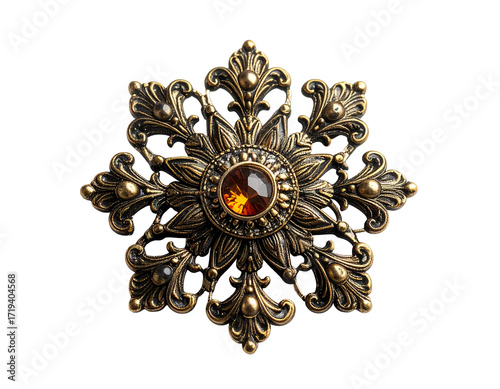 Ornate bronze snowflake brooch with amber gemstone center, intricate detailing and a dark background