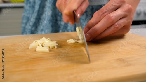 Wallpaper Mural Chef woman hands cooking chopping cutting garlic on wooden board on kitchen. Fresh ingredients, culinary techniques, homemade preparing healthy vegetables, cook food, pungent seasoning for dish. Torontodigital.ca
