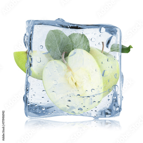 Fresh green apples inside ice cube isolated on white