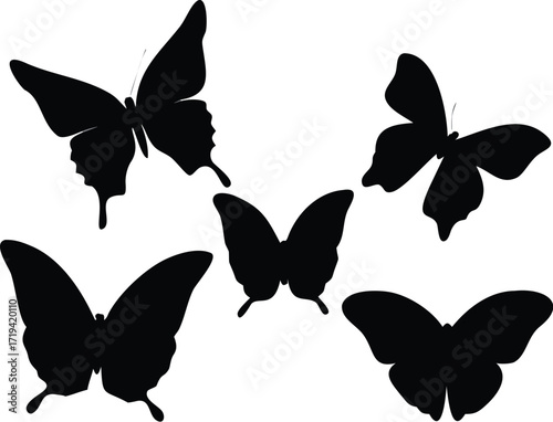 Five black butterfly silhouettes in flight insect flying