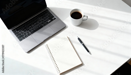 Minimalist Workspace Flat Lay with Laptop, Notebook, Pen, and Coffee on White Desk