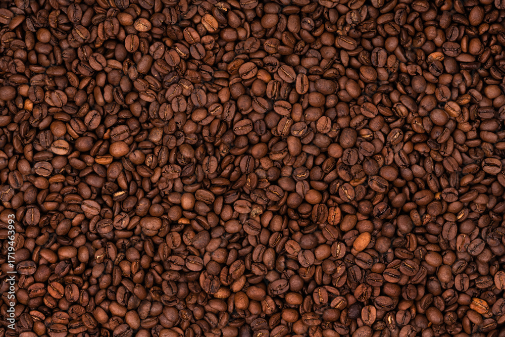 Fototapeta premium Freshly roasted coffee beans background texture. Close-up, top view.