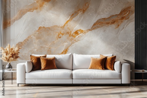 A modern living room, featuring a light beige marble-patterned wall, a white sofa with burnt-orange velvet throw pillows, and warm interior lighting, creating a sophisticated and inviting atmosphere.