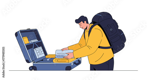 A traveler packs essentials into an open suitcase for a journey.