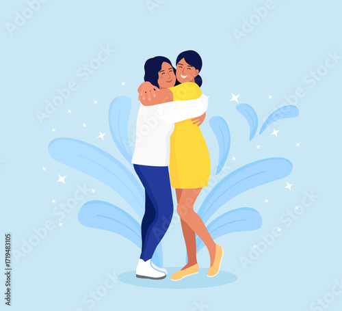 Women hugging each other with a smiling face. Happy meeting of two friends. Friendship, care and love concept