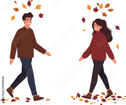 Happy couple walking together enjoying a beautiful autumn day with falling leaves and warm scarves.
