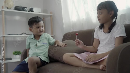 Girls and boys are playing with toys in the room, and the children are playing with colorful toys on the carpet on the floor.