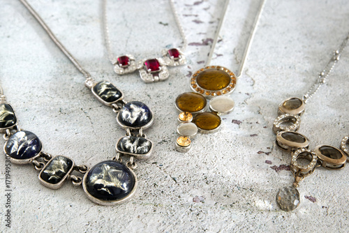Antique jewelry, vintage necklaces on a rustic background