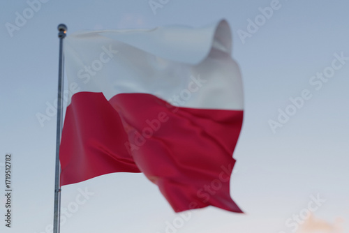 Polish national flag with red and white stripes waving in the wind on a clear sky background, symbol of patriotism, independence, and national pride of Poland.