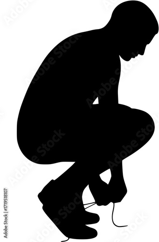 Man tying shoelaces in squat position
