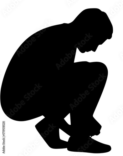 Man tying shoelaces in squat position
