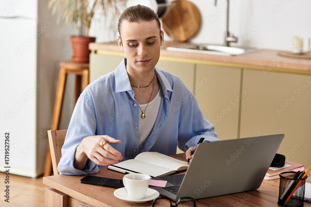 Obraz premium Young handsome man engaged in creative work at home while sipping coffee in a cozy setting