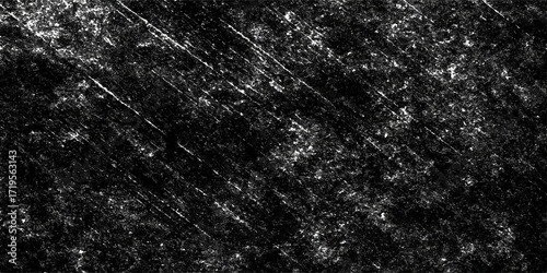 Abstract grunge texture of black and white rain drops on a stone wall