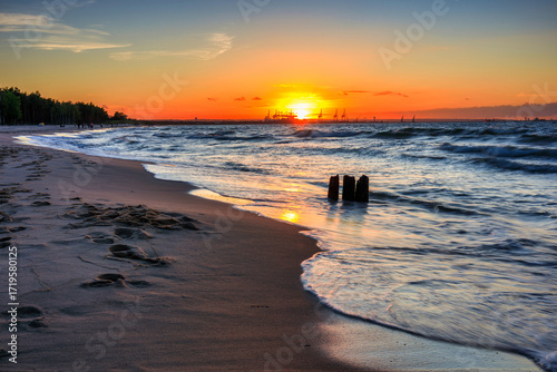 Fototapeta Naklejka Na Ścianę i Meble -  Sunset over the Baltic Sea beach in Gorki Zachodnie, Gdansk. Poland