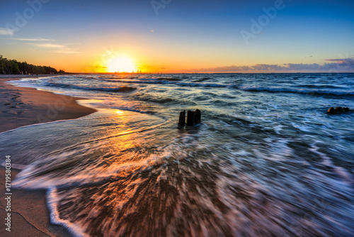 Fototapeta Naklejka Na Ścianę i Meble -  Sunset over the Baltic Sea beach in Gorki Zachodnie, Gdansk. Poland