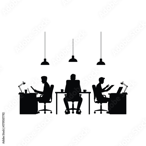 Silhouettes of people working at desks in a modern office with pendant lighting above them