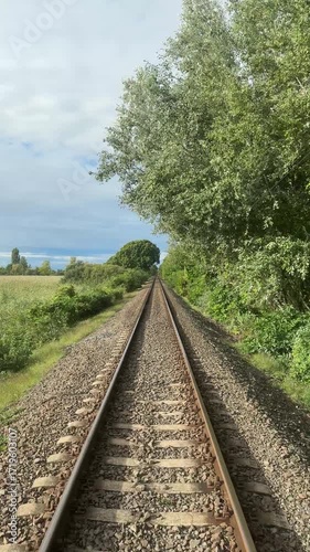 railway Train tracks traveling through the Hungarian countryside vertical