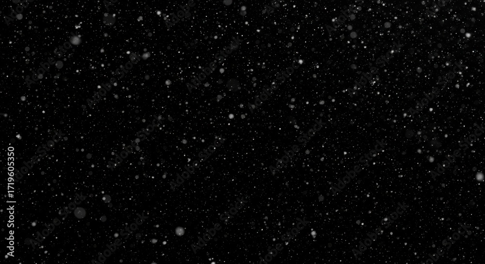 Obraz premium Atmospheric snowfall effect on a stark black background, showcasing winter textures and weather