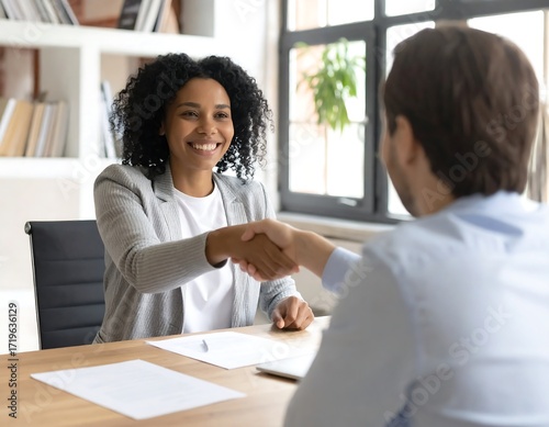 Interview handshake in modern office