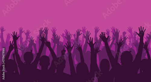 A large group of people with their hands raised in the air during a lively event.