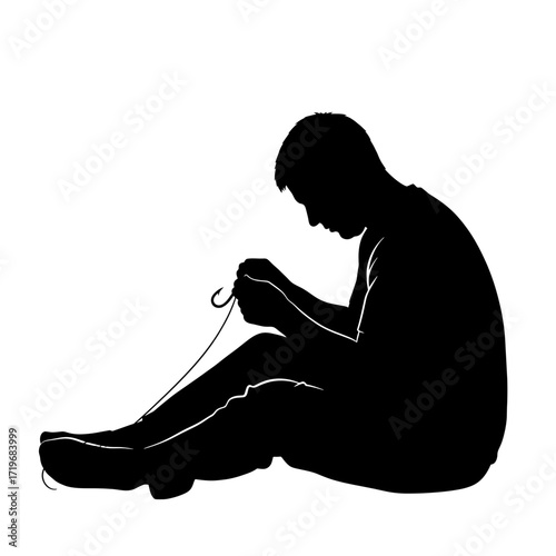 Man tying shoelaces silhouette isolated on white background