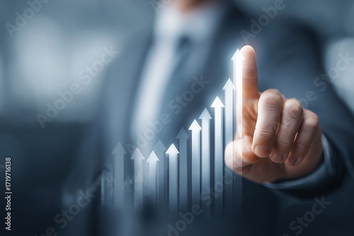 professional pointing toward bar graph with upward arrows