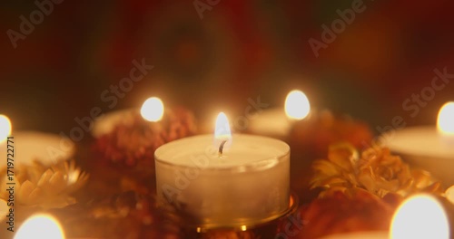  Close up of Diwali Candles spinning on a golden chandelier for the Festival of Lights