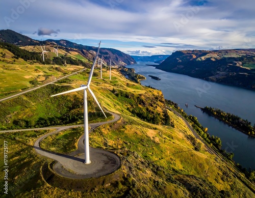Aerial view of wind turbines on a hillside overlooking a river valley