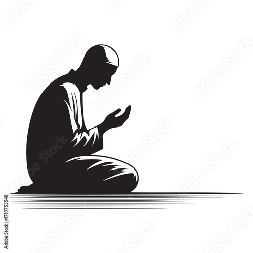 Man performing islamic prayer in a dark silhouette
