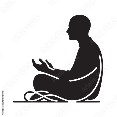 Man performing islamic prayer in a dark silhouette