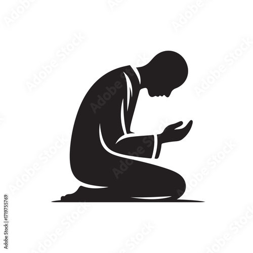 Man performing islamic prayer in a dark silhouette