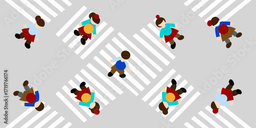 Top down view of diverse people walking across a pedestrian crossing on a city street