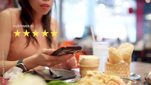 A woman in a restaurant uses her smartphone while five star customer reviews highlight food quality, service excellence, and dining satisfaction.