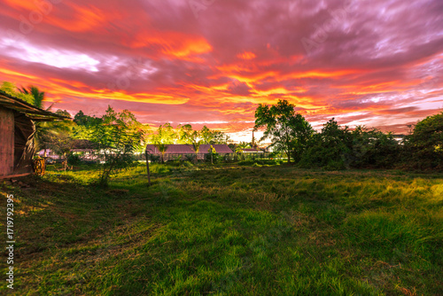 The background of the twilight sunset, the sky has beautiful changes, amidst the green fields and various trees, there is a cool breeze blowing throughout the journey to the viewpoint.