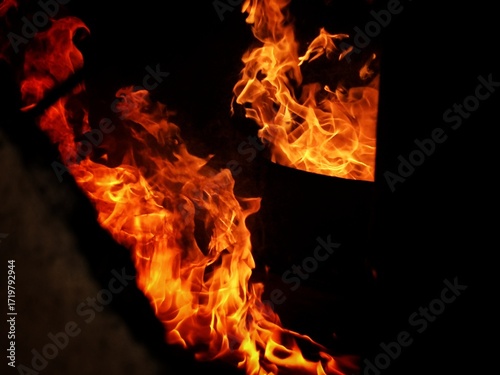 Flame, fire, building fire, intensity of fire inside a room, room for fire training for firefighters, damage caused by fire.