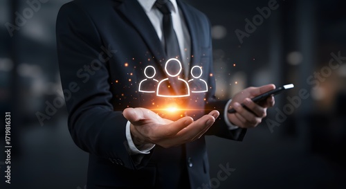 Businessman Holding Digital Icons of People and Smartphone