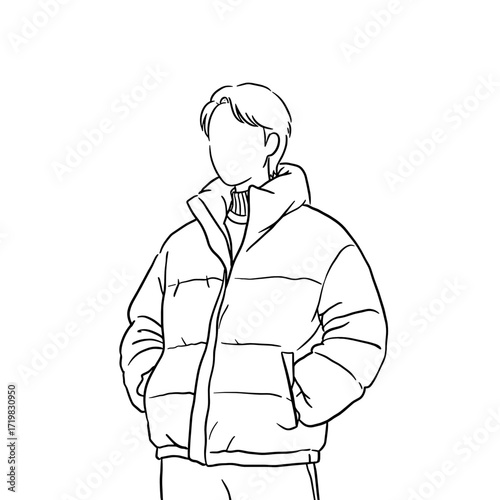 Young man standing in puffer jacket with hands in pockets  