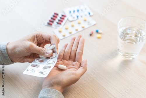 Healthcare Harmony: Close-Up Hands Holding Medication and Water Glass for Optimal Wellness, Pharmaceutical Treatment and mental health treatment
