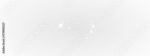 Elegant golden particles with dazzling stardust glow, luminous spark and shimmering bokeh in abstract transparent background for seasonal holiday card illustration and decoration.