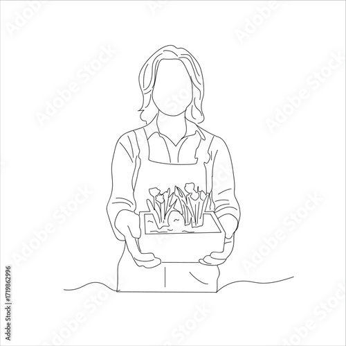 female farmer carrying flowers.A young female staff member at a flower shop holding a flower pot 