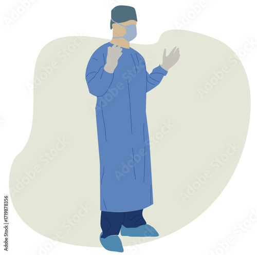 doctor wearing surgical gown. doctor is wearing a surgical gown.male doctor surgeon wearing surgical gloves mask and green